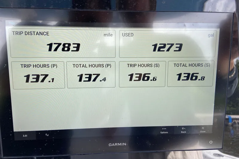 Slide: The Image of Display screen showing trip data for Sportsman Open 302 Center Console, 2026 model. - 10