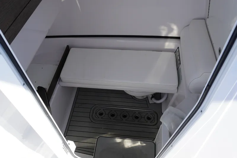 Slide: The Image of 2026 Sportsman Open 302 Center Console interior with cushioned seating and non-slip flooring. - 30