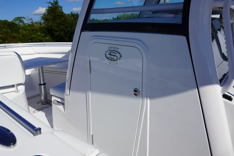 Slide: The Image of 2026 Sportsman Open 302 Center Console boat interior with seating and table. - 29