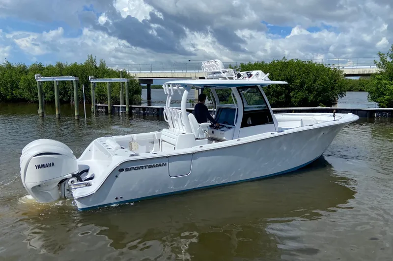 Slide: The Image of 2026 Sportsman Open 302 Center Console boat on water, featuring Yamaha engines. - 5