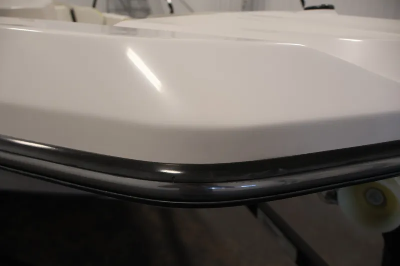 Slide: The Image of Close-up of 2016 Scarab 165 G boat hull with sleek white finish. - 36