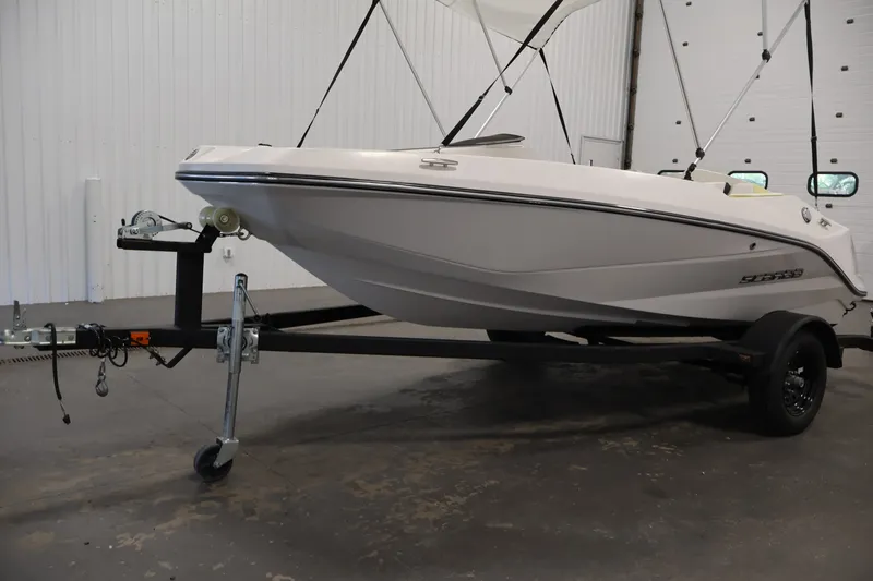 Slide: The Image of 2016 Scarab 165 G boat on trailer in indoor storage facility. - 32