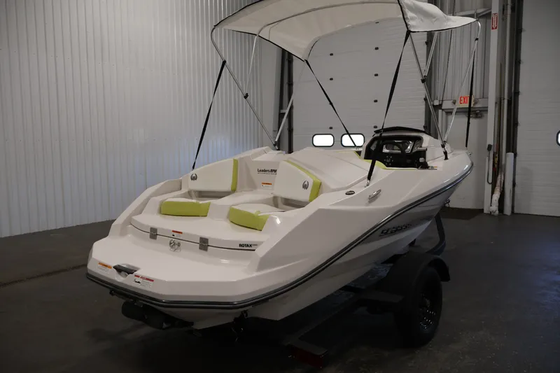 Slide: The Image of 2016 Scarab 165 G boat with canopy in indoor storage. - 5