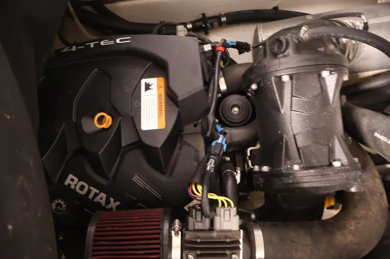 Slide: The Image of Engine compartment of a 2016 Scarab 165 G with Rotax motor components. - 26