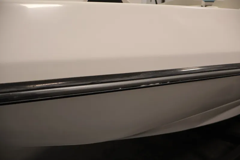 Slide: The Image of Close-up of 2016 Scarab 165 G boat hull with black trim detail. - 34