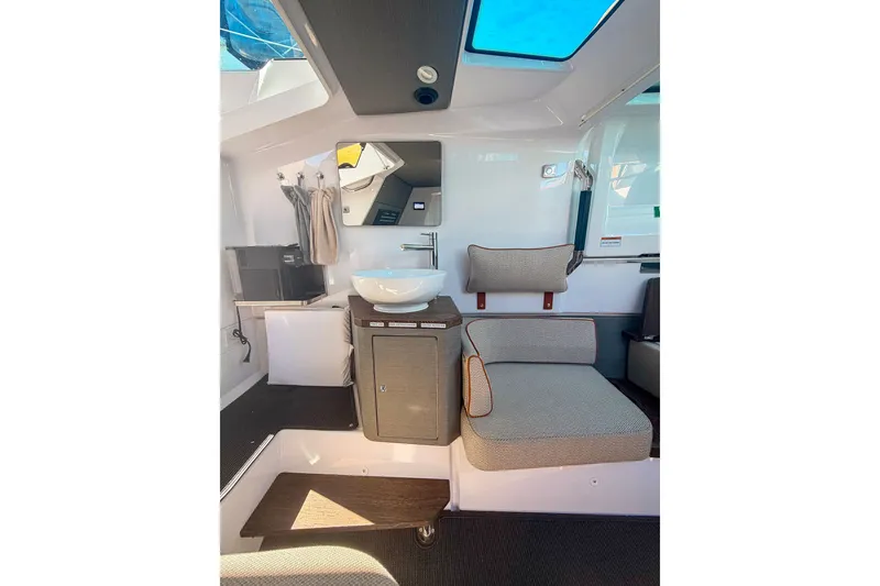 Slide: The Image of Interior of 2021 Axopar 37 XC Cross Cabin with seating and sink. - 29