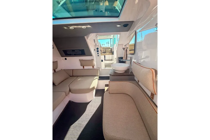 Slide: The Image of Interior of 2021 Axopar 37 XC Cross Cabin with modern seating and skylight. - 30