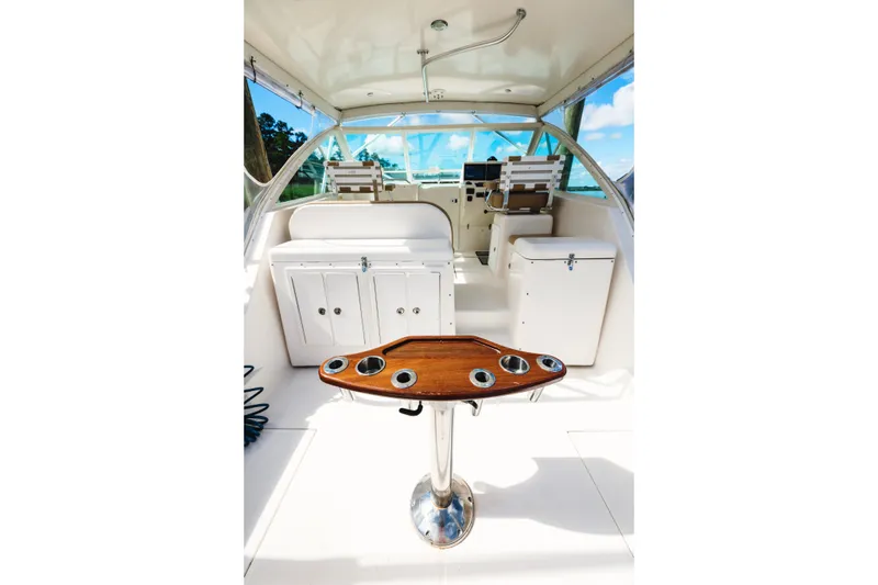 Slide: The Image of Interior of 2006 Carolina Classic 32 boat with helm and seating area. - 28