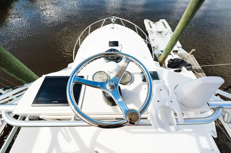 Slide: The Image of Helm of 2006 Carolina Classic 32 boat with steering wheel and navigation equipment. - 31