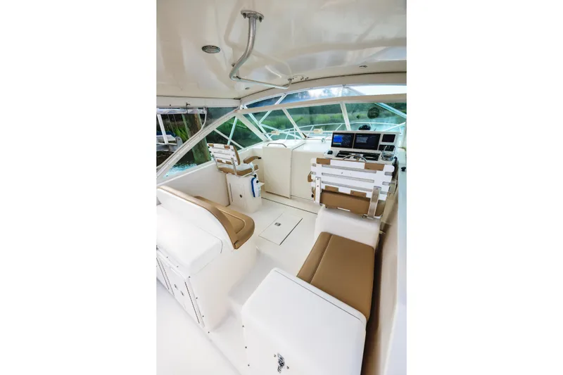 Slide: The Image of 2006 Carolina Classic 32 boat interior with helm, seating, and navigation equipment. - 35