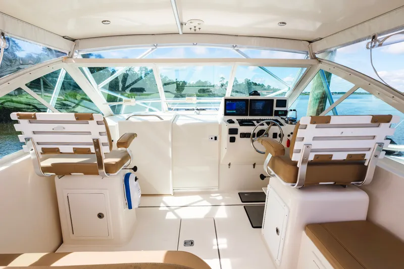 Slide: The Image of Interior of 2006 Carolina Classic 32 boat with helm, seating, and navigation equipment. - 22