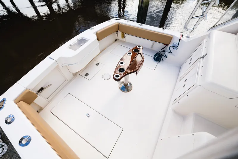 Slide: The Image of Spacious deck of 2006 Carolina Classic 32 boat with seating and rod holders. - 37