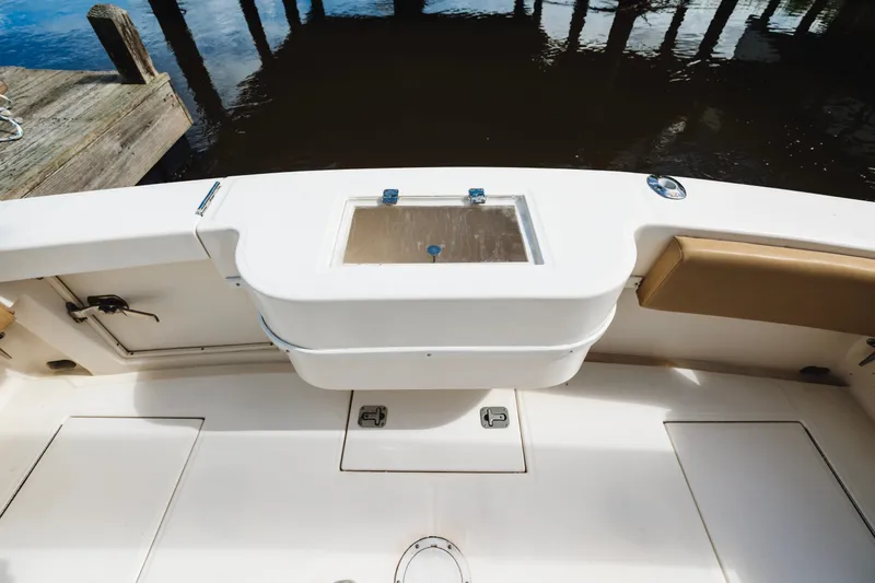 Slide: The Image of 2006 Carolina Classic 32 boat deck with storage compartments and seating. - 30