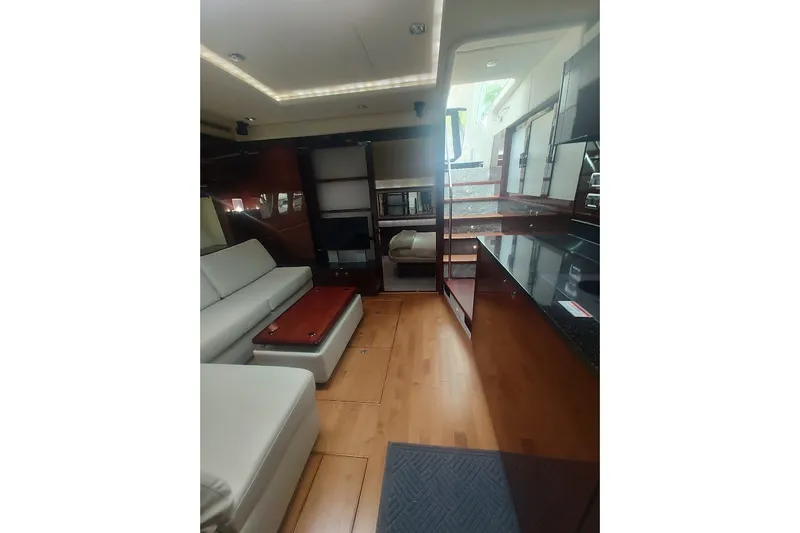Slide: The Image of Luxurious interior of 2010 Sea Ray Sundancer 540 yacht with modern furnishings and wood flooring. - 19