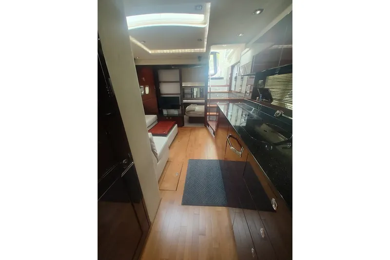 Slide: The Image of Luxurious interior of 2010 Sea Ray Sundancer 540 yacht with modern kitchen and seating area. - 21