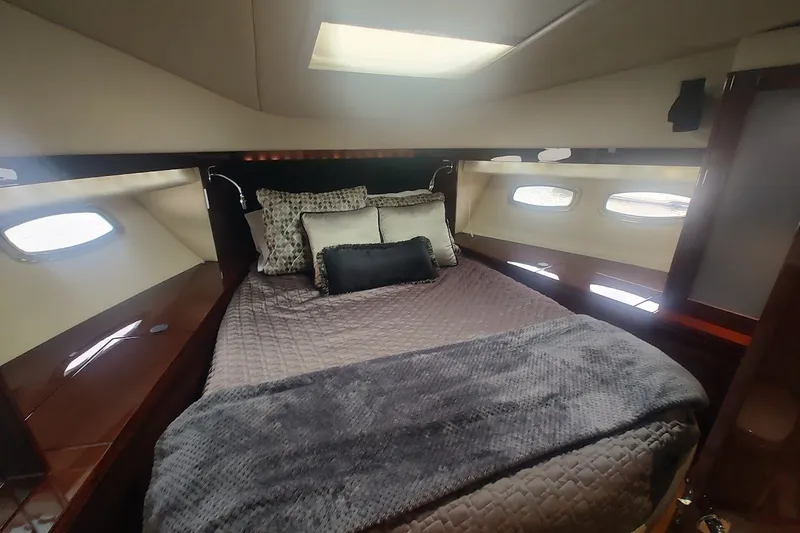 Slide: The Image of Luxurious cabin interior of 2010 Sea Ray Sundancer 540 yacht with cozy bedding. - 26