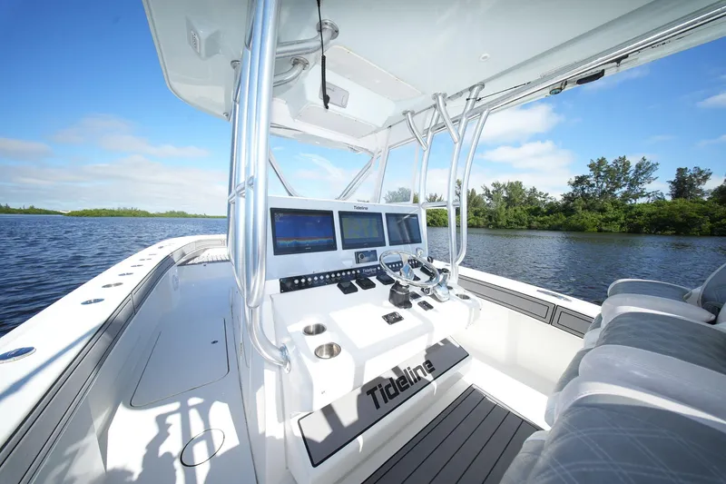 Slide: The Image of 2020 Tideline 365 Offshore boat interior with modern navigation system on a sunny day. - 49