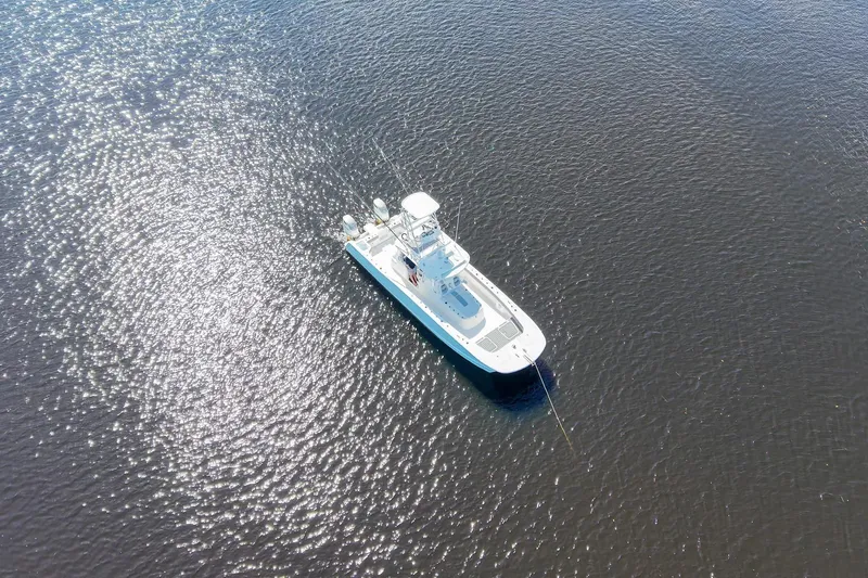 Slide: The Image of Aerial view of 2020 Tideline 365 Offshore boat on shimmering water. - 13