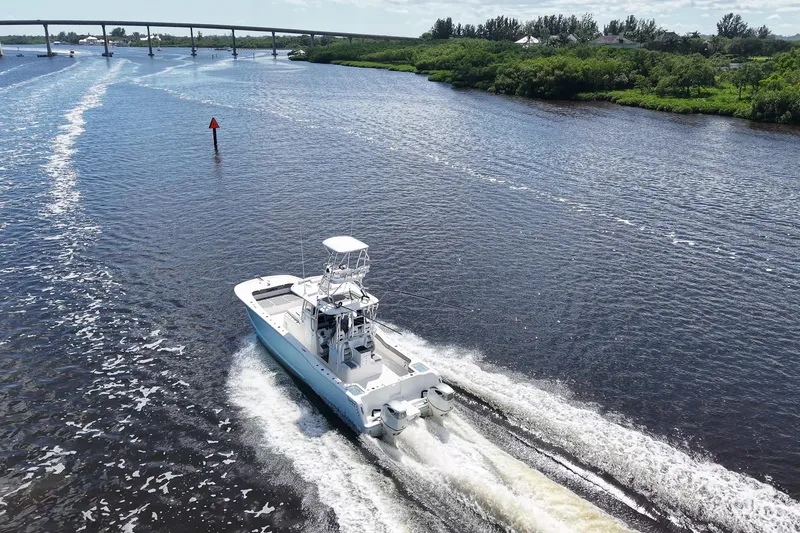 Slide: The Image of Aerial view of 2020 Tideline 365 Offshore boat cruising on a scenic river. - 27