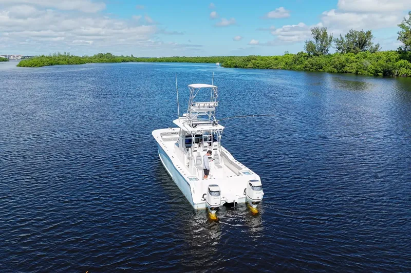 Slide: The Image of Aerial view of 2020 Tideline 365 Offshore boat cruising on a serene waterway. - 14