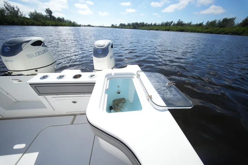 Slide: The Image of 2020 Tideline 365 Offshore boat with Suzuki engines on a calm river. - 66