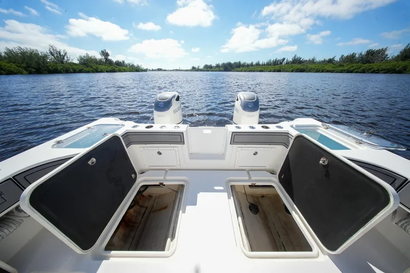 Slide: The Image of 2020 Tideline 365 Offshore boat with open storage compartments on a sunny day. - 88