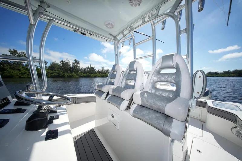 Slide: The Image of Interior of 2020 Tideline 365 Offshore boat with luxurious seating and steering wheel. - 63