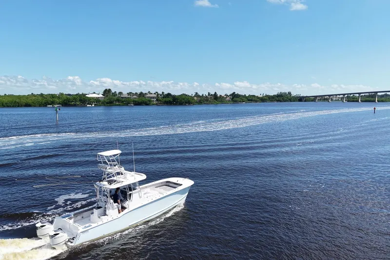Slide: The Image of 2020 Tideline 365 Offshore boat cruising on a sunny day near a bridge. - 23