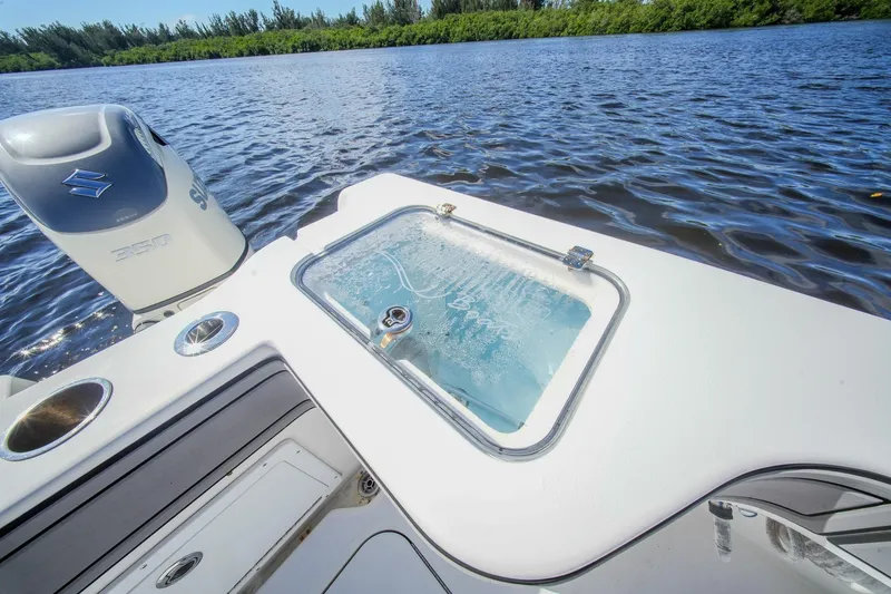 Slide: The Image of 2020 Tideline 365 Offshore boat with Suzuki engine on a serene waterway. - 65