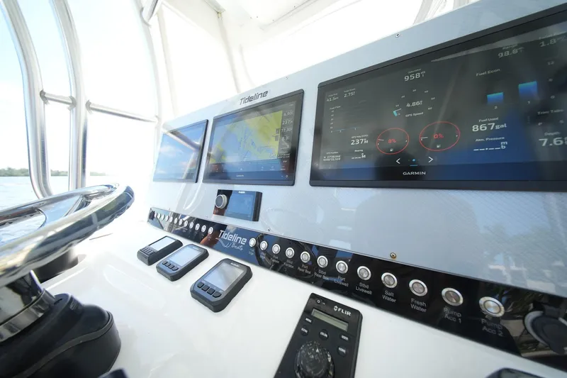 Slide: The Image of 2020 Tideline 365 Offshore boat dashboard with advanced navigation and control systems. - 85