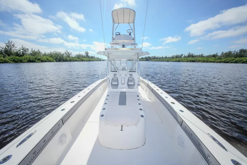 Slide: The Image of 2020 Tideline 365 Offshore boat on calm water under a clear blue sky. - 60