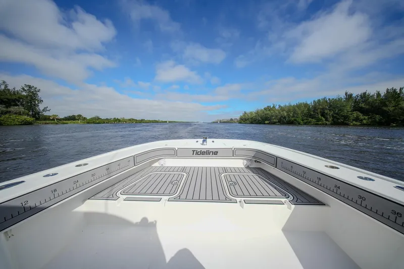 Slide: The Image of 2020 Tideline 365 Offshore boat on a scenic river under a blue sky. - 33