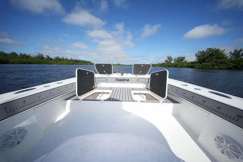 Slide: The Image of 2020 Tideline 365 Offshore boat on calm water under blue sky. - 55