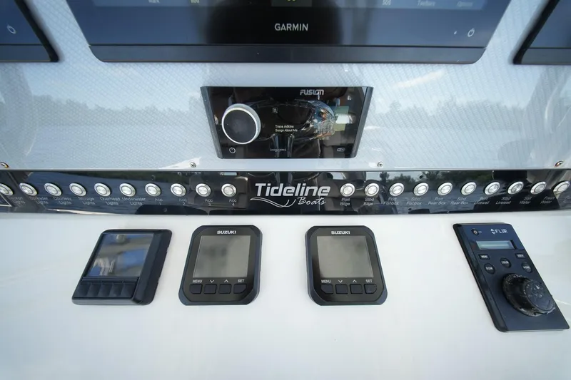Slide: The Image of Control panel of 2020 Tideline 365 Offshore boat with Suzuki and Garmin displays. - 53