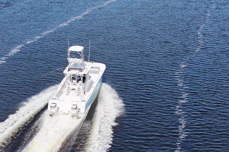 Slide: The Image of 2020 Tideline 365 Offshore boat cruising on open water, leaving a wake. - 16