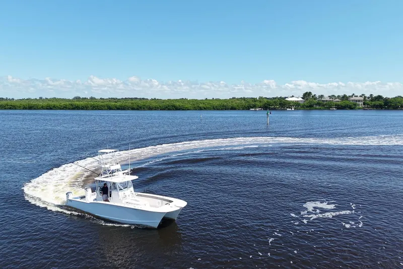 Slide: The Image of 2020 Tideline 365 Offshore boat making a turn on a sunny day. - 22