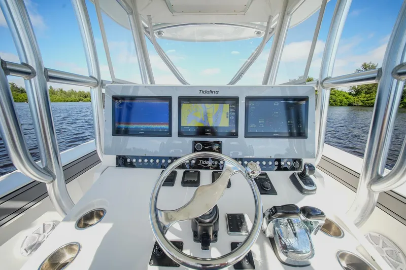 Slide: The Image of Cockpit of 2020 Tideline 365 Offshore boat with advanced navigation displays. - 54