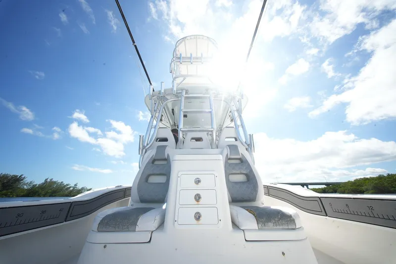 Slide: The Image of 2020 Tideline 365 Offshore boat under bright sun and blue sky. - 84