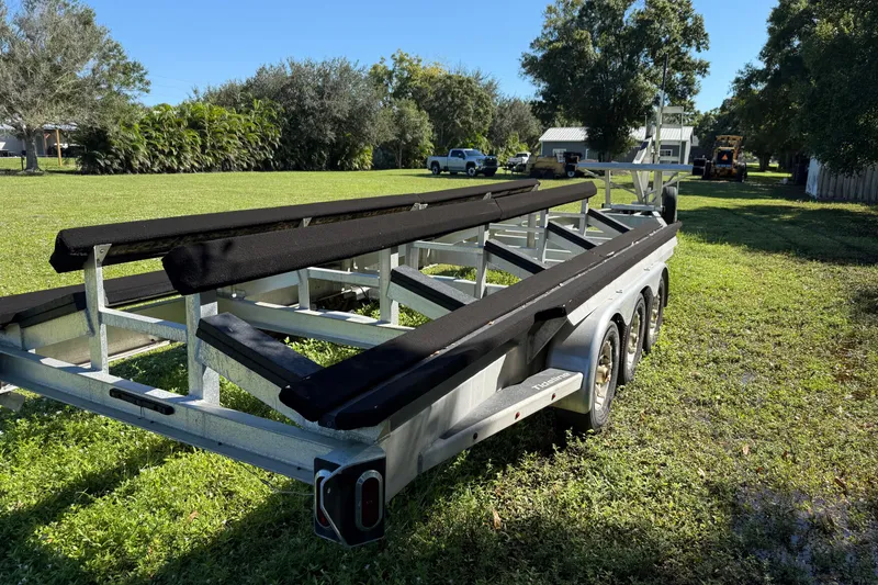 Slide: The Image of Trailer for 2020 Tideline 365 Offshore boat on grassy field. - 90