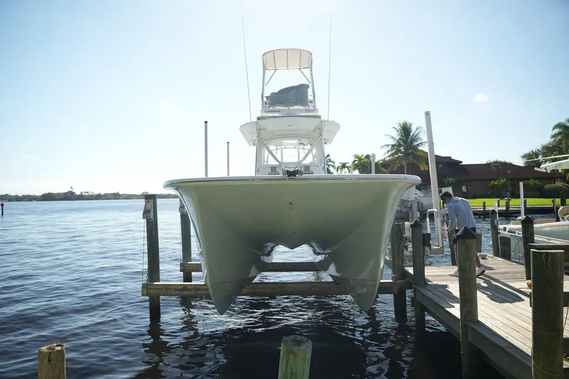 Slide: The Image of 2020 Tideline 365 Offshore boat docked, viewed from the front, with clear blue sky. - 39