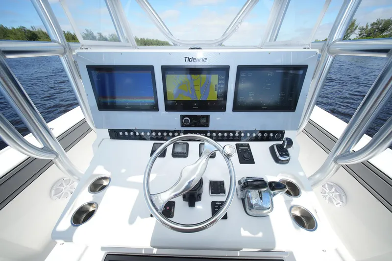 Slide: The Image of Helm of 2020 Tideline 365 Offshore boat with advanced navigation displays and controls. - 51