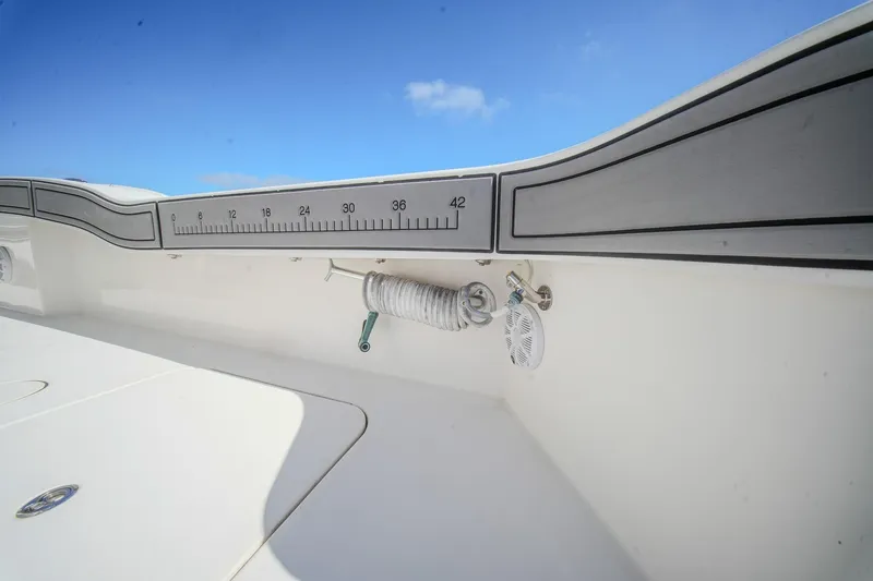 Slide: The Image of 2020 Tideline 365 Offshore boat interior with measuring scale and coiled rope. - 68