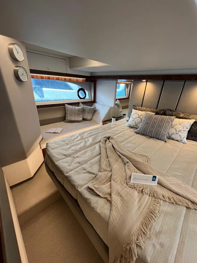 Slide: The Image of Luxurious bedroom interior of 2022 Riviera 505 SUV yacht with elegant bedding and decor. - 37