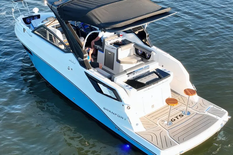 The Image of 2025 Grandfort 300 GTS luxury boat on water, featuring sleek design and modern amenities. - 2