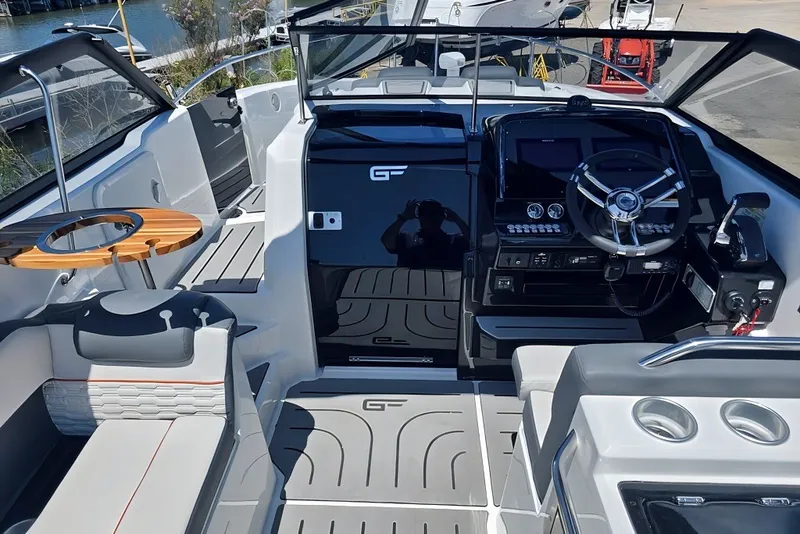 Slide: The Image of Interior of 2025 Grandfort 300 GTS boat with modern steering and seating. - 16