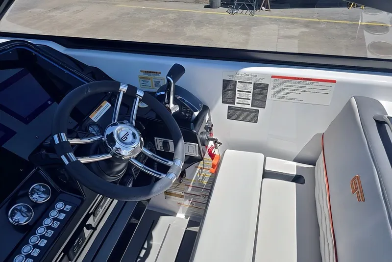 Slide: The Image of Steering wheel and controls of 2025 Grandfort 300 GTS boat cockpit. - 21