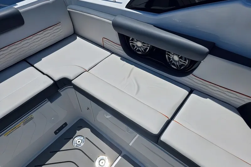 Slide: The Image of Luxurious seating area in 2025 Grandfort 300 GTS boat with integrated speakers. - 18