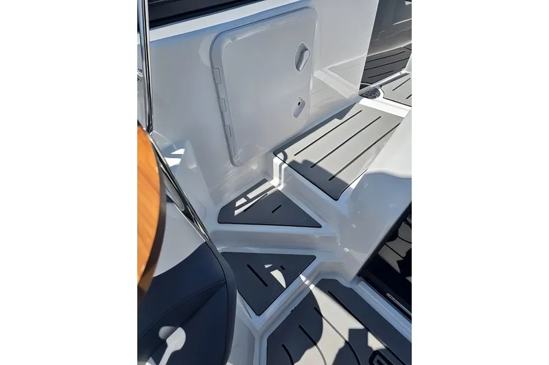 Slide: The Image of Interior view of 2025 Grandfort 300 GTS boat, featuring sleek design and modern flooring. - 23