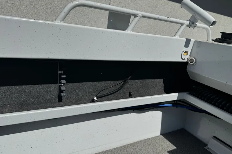 Slide: The Image of Interior view of a 2006 North River 21 Seahawk boat, showcasing storage and wiring. - 18