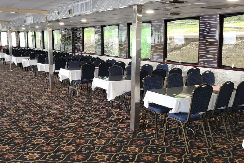 Slide: The Image of Interior of a 1985 custom dinner excursion passenger vessel with elegant dining setup. - 2
